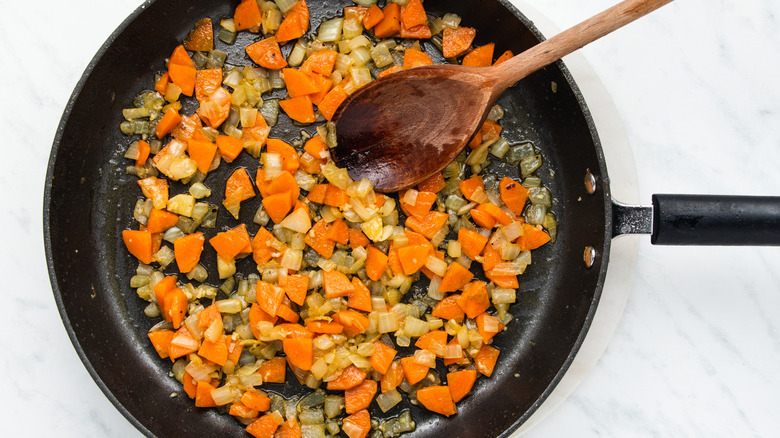 onion and carrots in skillet 