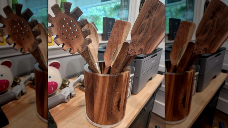 Wooden cooking utensils in matching cup