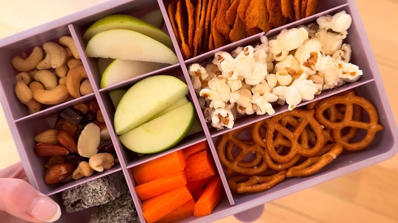 Purple food storage container filled with food