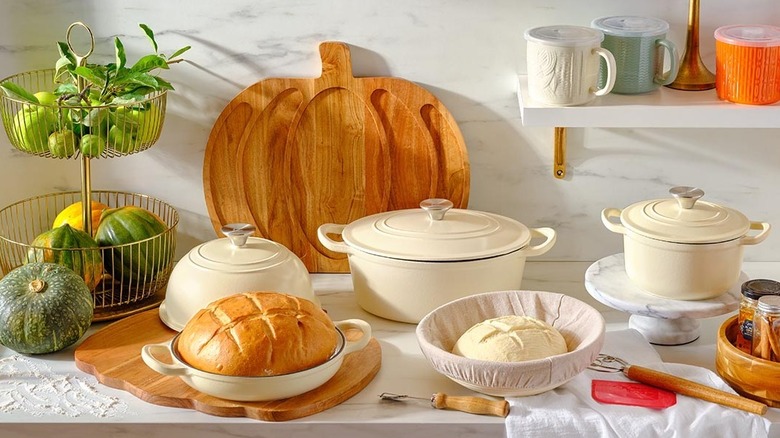 White enamel lidded pots on kitchen counter