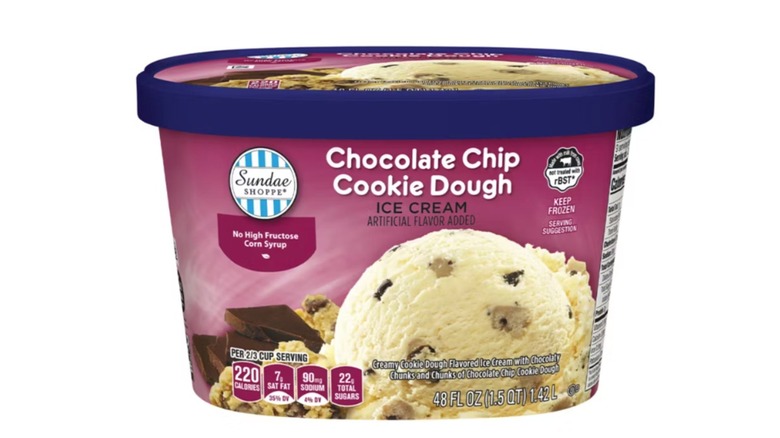 A tub of Aldi's chocolate chip cookie dough ice cream isolated on a white background