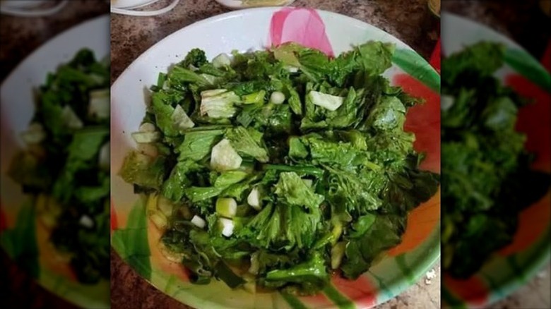 Close up view of a bowl of kilt lettuce also known as killed lettuce or wilted lettuce