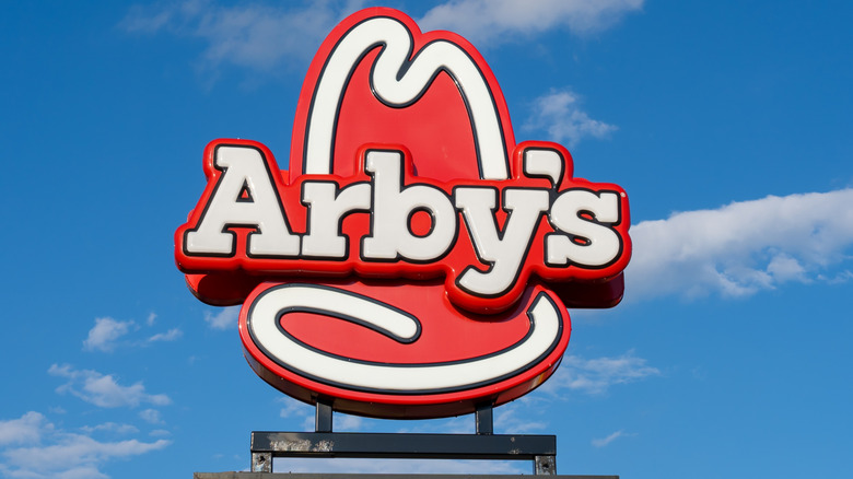 Arby's restaurant sign with blue sky in the background