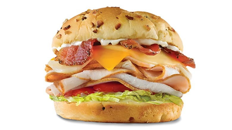 Triple cheese turkey BLT from Arby's on white background
