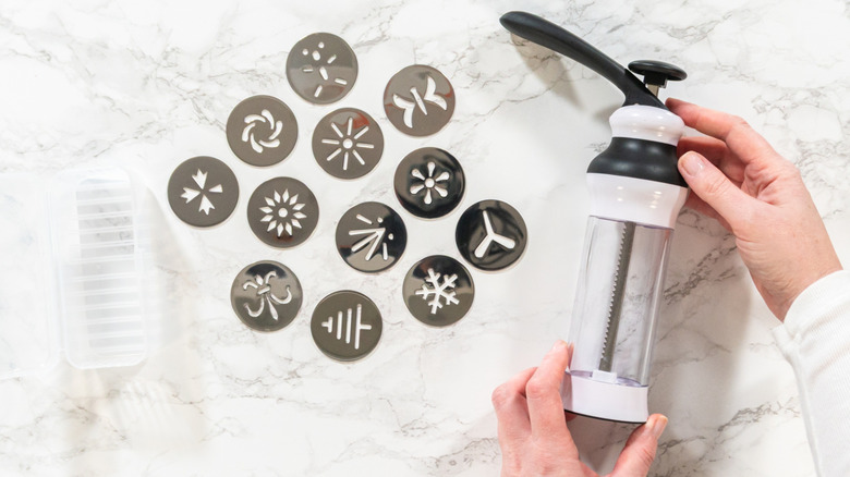 Cookie press with various discs