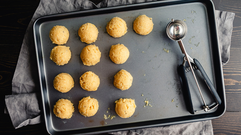 Cookie scoop with evenly-sized balls of cookie dough