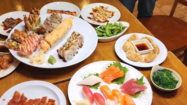 Table of sushi and apps at Yamato