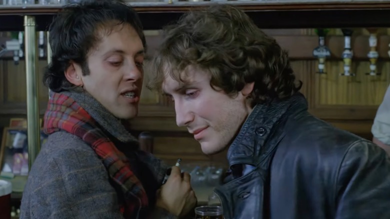 In a still from "Withnail & I," Withnail (Richard E. Grant) sneers at Marwood (Paul McGann)