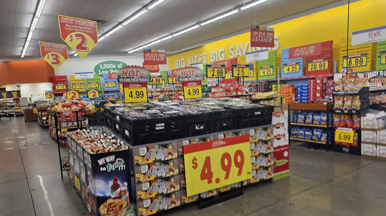 Produce and snacks in Food 4 Less with sales signs