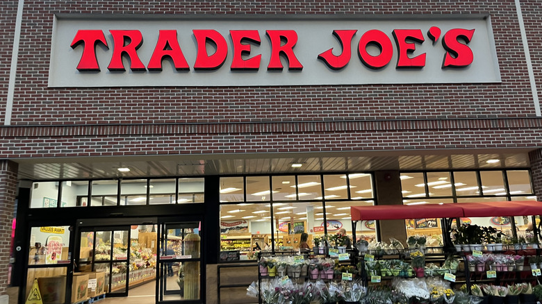 Trader Joe's brick storefront with flowers out front