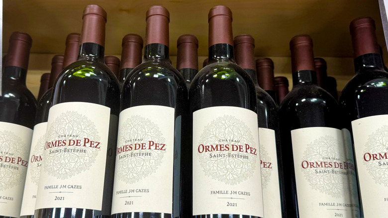 bottles of red wine stacked in crate