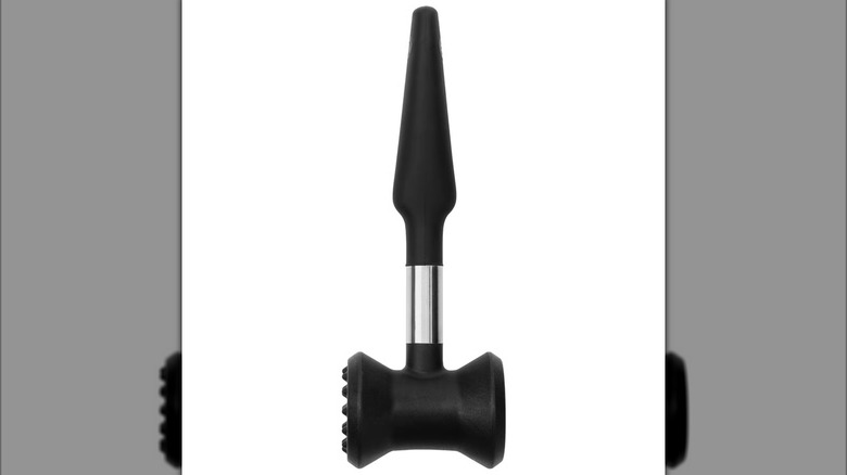 Black meat tenderizer hammer on white background