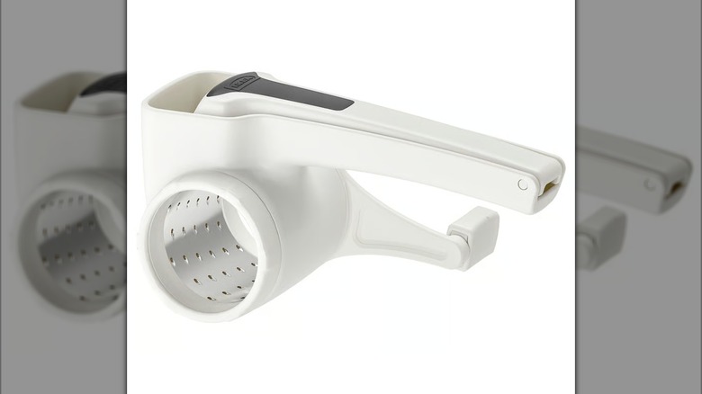 White rotary cheese grater on white background