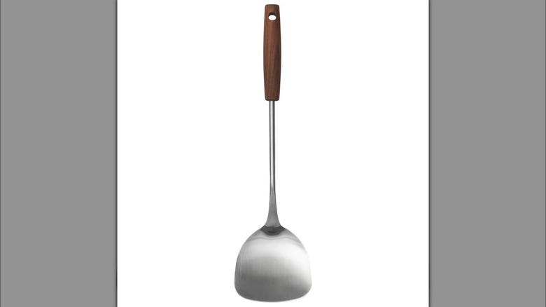 Stainless steel spatula with a dark wood handle