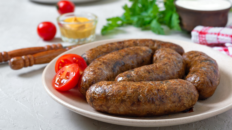 crispy plant-based sausages on plate