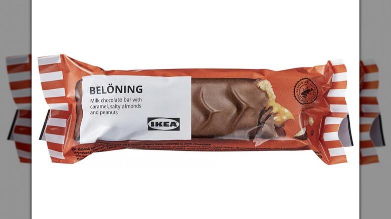 A Belöning Milk Chocolate Bar with Caramel, Almonds, and Peanuts on a white background
