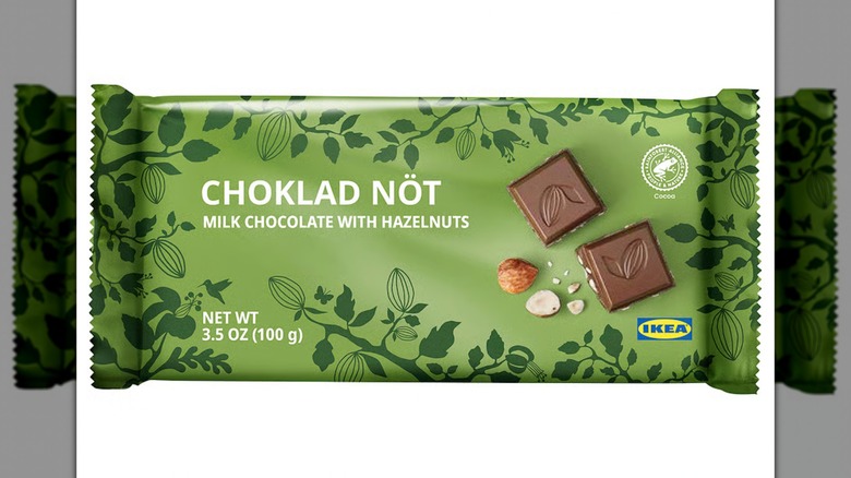 A Choklad Nöt Milk Chocolate bar with Hazelnuts on a white background