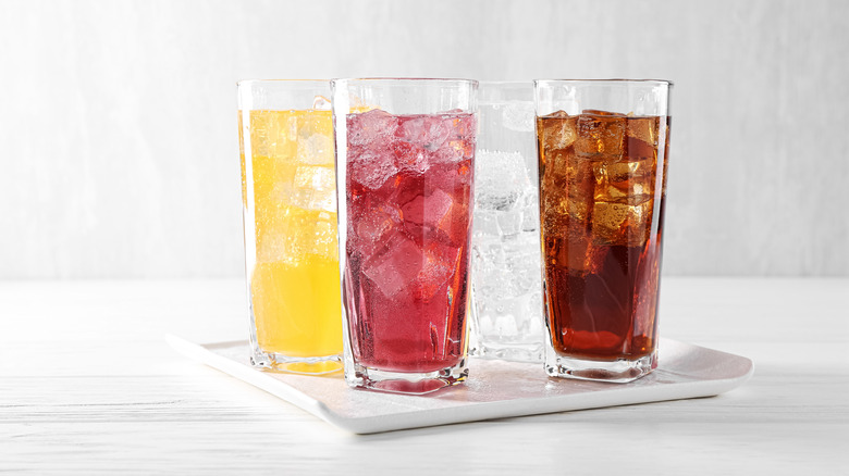 A selection of sodas in glasses