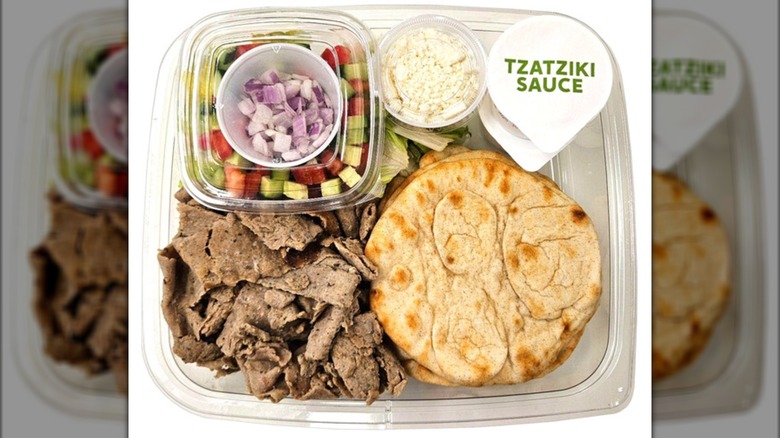 A Costco gyro kit in a clear plastic container on a white background