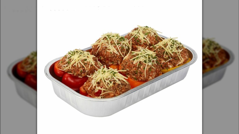 Costco stuffed peppers in a foil pan on a white background