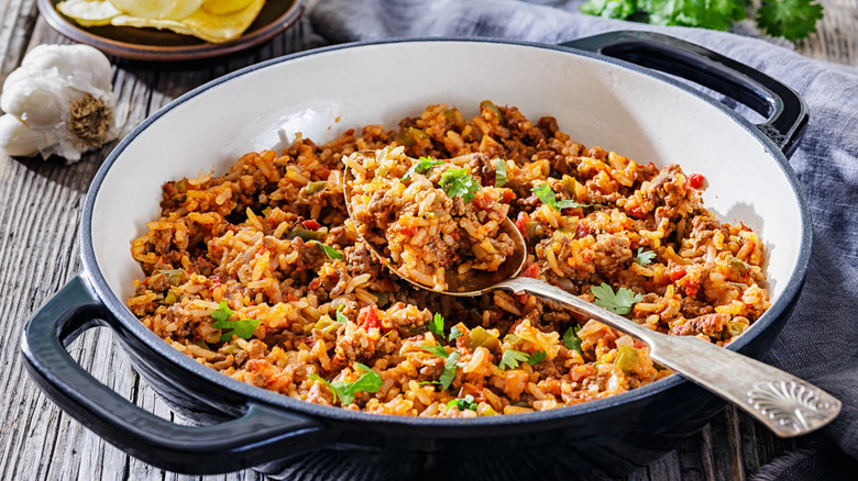 A pot of ground beef, rice, and peppers
