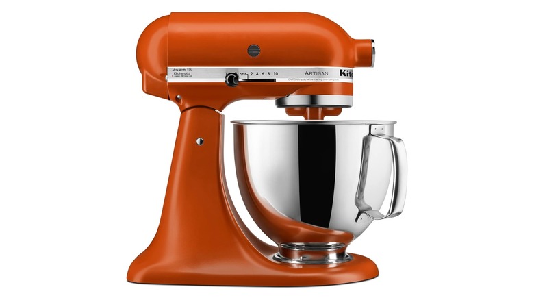 A burnt orange KitchenAid stand mixer in profile view
