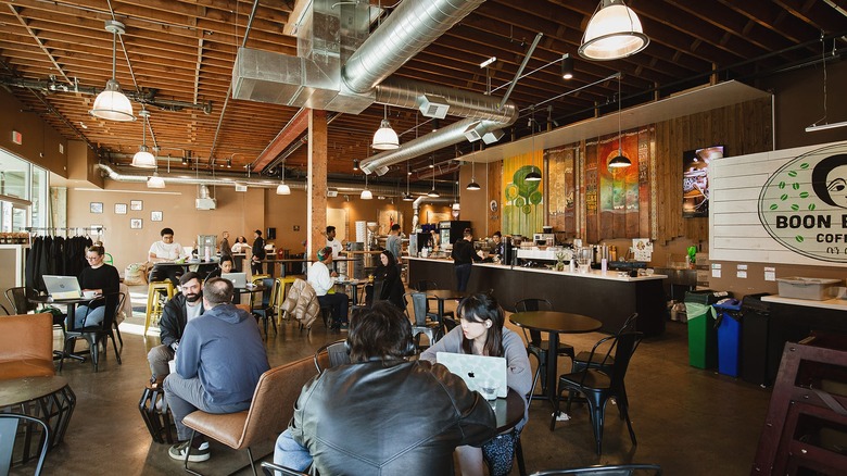 The chic interior of Boon Boona Coffee wih high ceilings and exposed beams