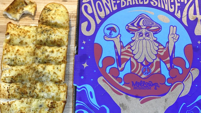 Mellow Mushroom breadstick box next to cheesy bread
