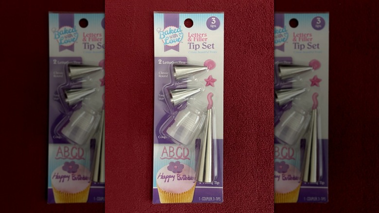 Baked With Love Icing Tip Set and Coupler on a red background