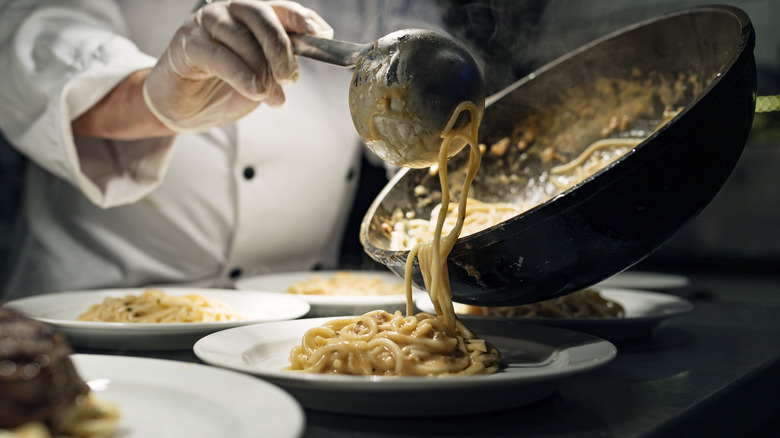 plating pasta dish