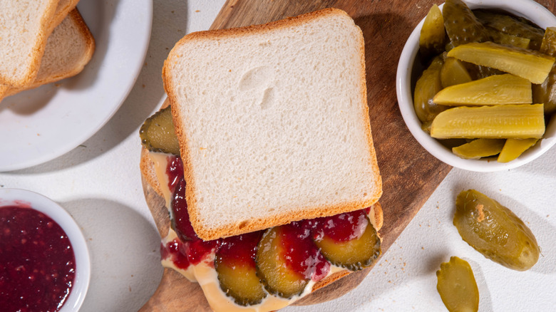 Peanut butter and pickle sandwich with strawberry jam