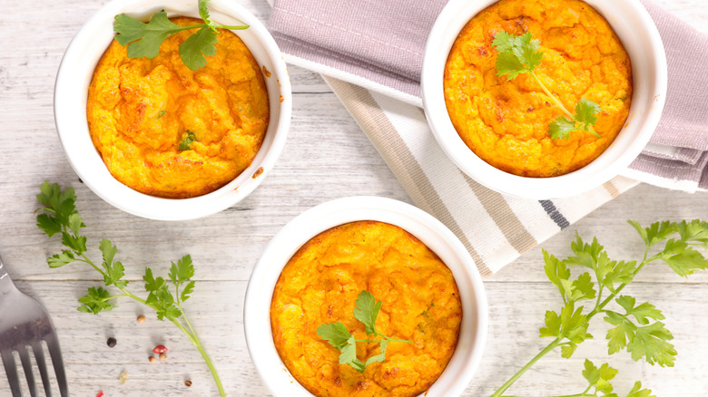 overhead shot of 3 ramekins with single-serving carrot casseroles