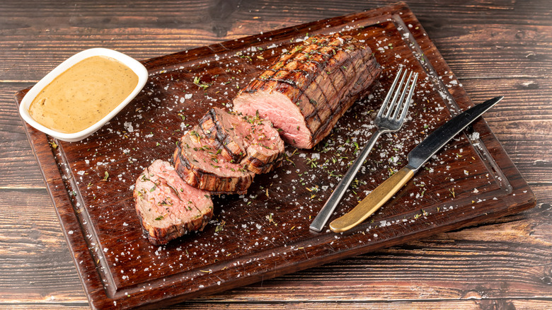 Sliced beef tenderloin with mustard sauce