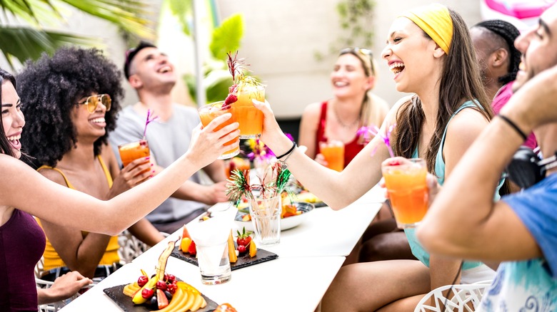 people drinking cocktails during day