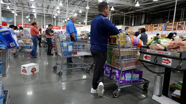 Customers in line at Costco checkout