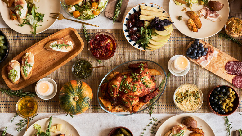 Top view of a holiday meal spread with many different dishes laid out