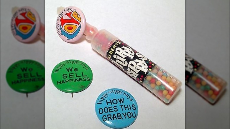 A Hippy Sippy is seen with two badges used to advertise the snack