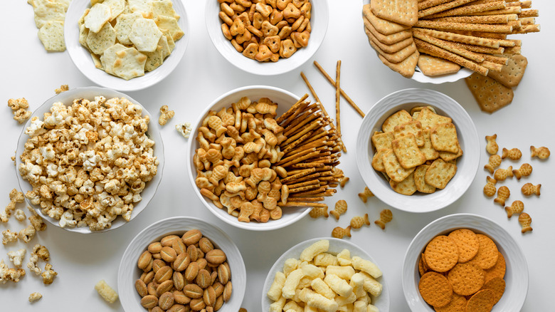 Various salty snacks are seen from overhead