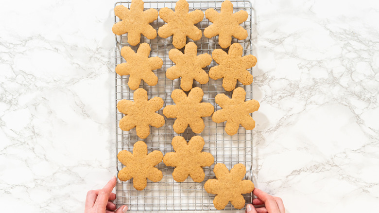 Cookies cooling down on a wire rack, placed on a marble table