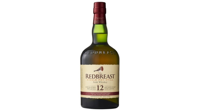 Bottle of Redbreast Single Pot Still Irish Whiskey against white background.