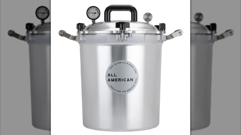 An All American 1930 30-quart Cast Aluminum Pressure Cooker on a white background