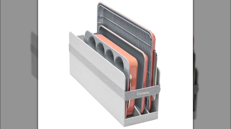 A Caraway Four-piece Ceramic Non-Stick Bakeware Set in pink on a white background