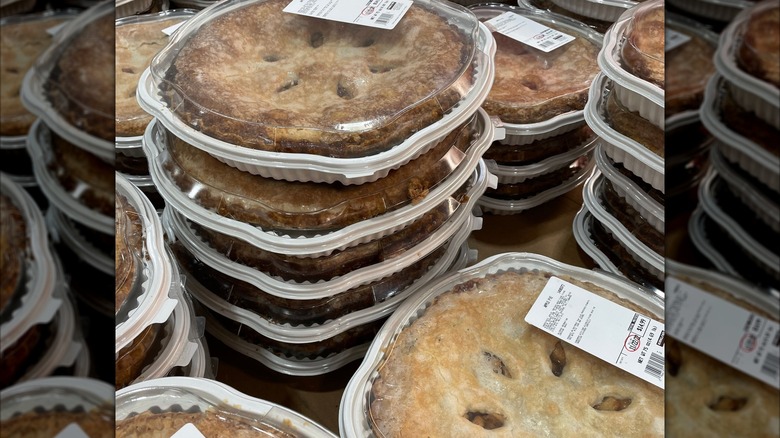 Stacks of Costco apple pies in their display packaging