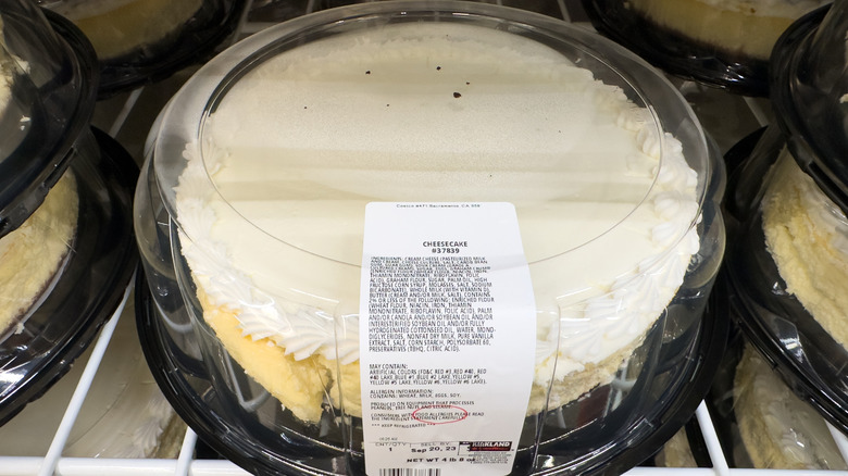 A shelf of Costco cheesecakes in their packaging