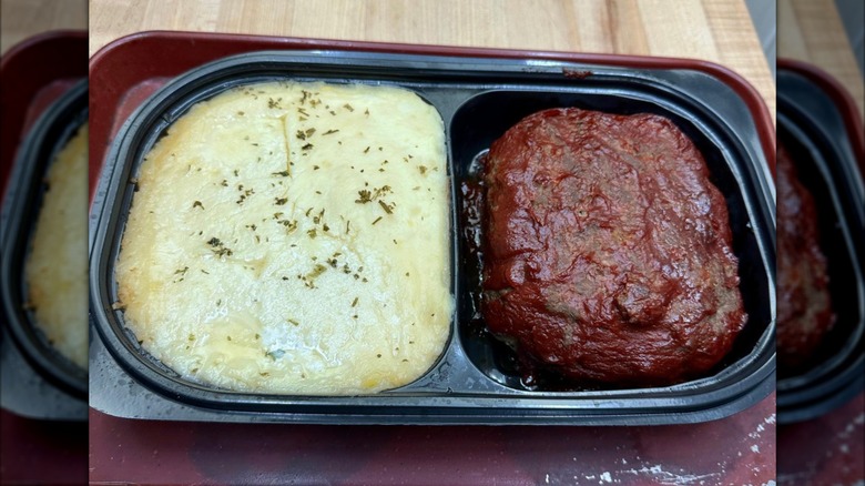 Costco's meatloaf with mashed potatoes in a plastic serving tray