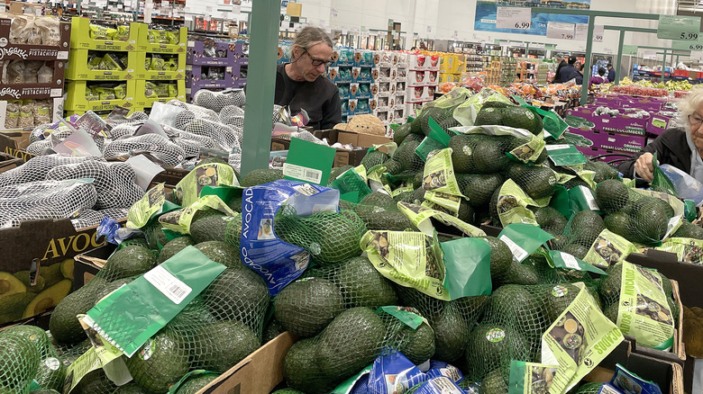 Customers shop for avocados in Costco