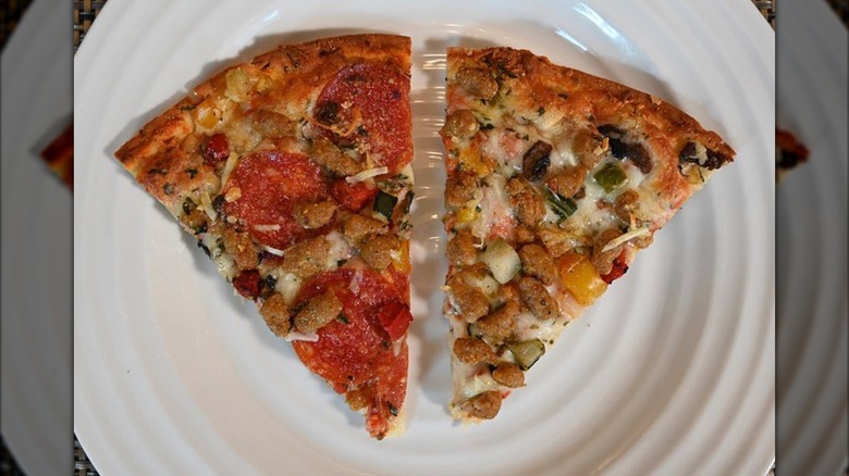 Two slices of Kirkland Signature Deluxe Cauliflower Crust Pizza