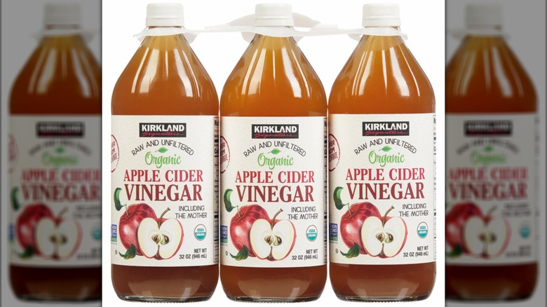Three bottles of Kirkland apple cider vinegar
