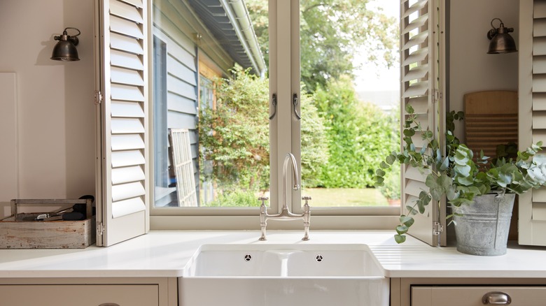 Kitchen windows with wooden shutters