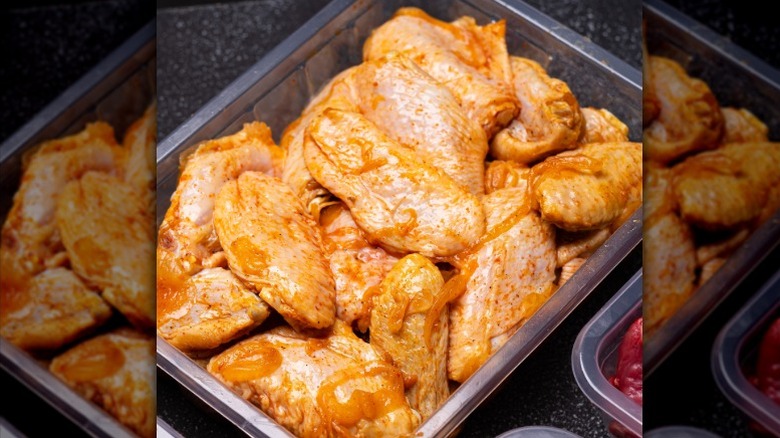 Chicken wings marinating in a pumpkin-based marinade